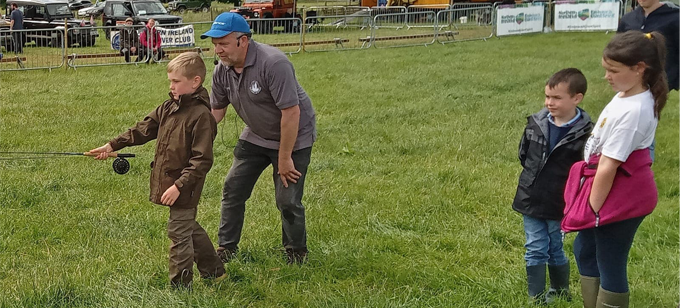 Kids Casting at the Antrim Fly Fair with ray McKeeman from Straid Fishery